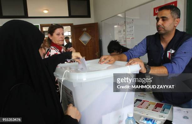 Lebanese woman casts her ballot at a polling station in the city of Nabatieh in southern Lebanon on May 6 as the country voted in its first...