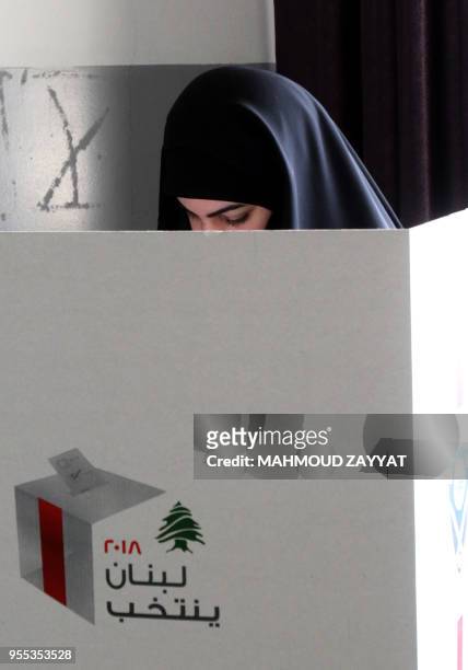 Lebanese woman casts her ballot at a polling station in the city of Nabatieh in southern Lebanon on May 6 as the country voted in its first...