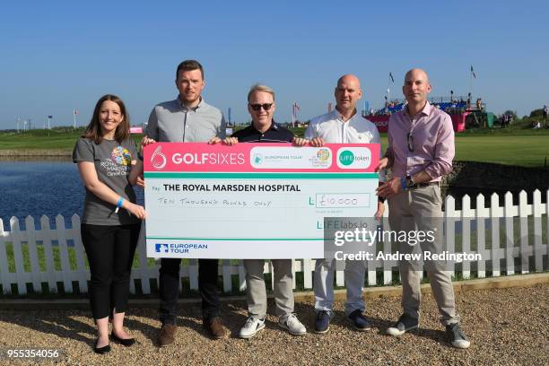 Keith Pelley, Chief Executive of the European Tour poses at a charity cheque presentation during day two of the GolfSixes at The Centurion Club on...