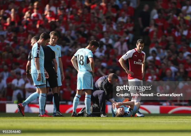 Burnley's Ashley Barnes picks up an injury during the Premier League match between Arsenal and Burnley at Emirates Stadium on May 6, 2018 in London,...