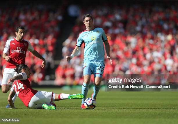 Burnley's Stephen Ward is challenged by Arsenal's Hector Bellerin during the Premier League match between Arsenal and Burnley at Emirates Stadium on...