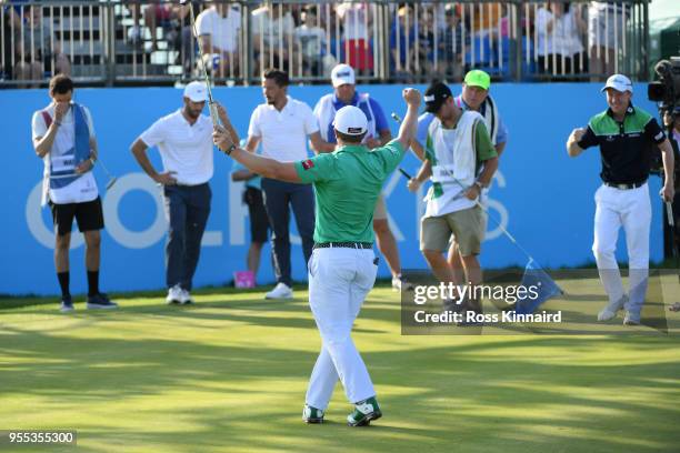 Paul Dunne of Ireland celebrates holing the winning putt to win the final match during day two of the GolfSixes at The Centurion Club on May 6, 2018...