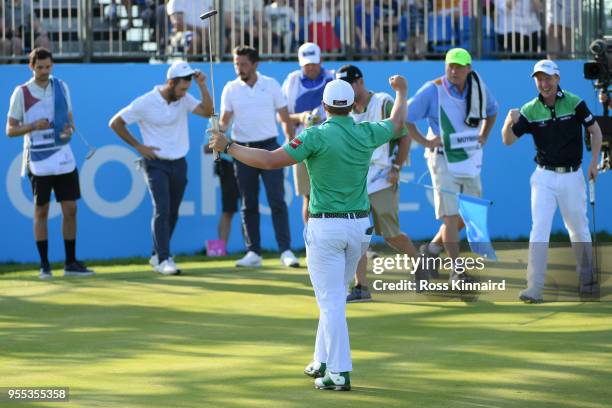 Paul Dunne of Ireland celebrates holing the winning putt to win the final match during day two of the GolfSixes at The Centurion Club on May 6, 2018...