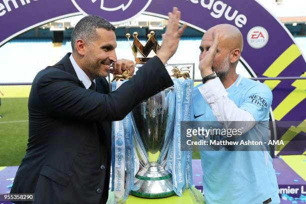 Khaldoon Al Mubarak the chairman of Manchester City and Pep Guardiola the head coach / manager of Manchester City with the Premier League trophy...