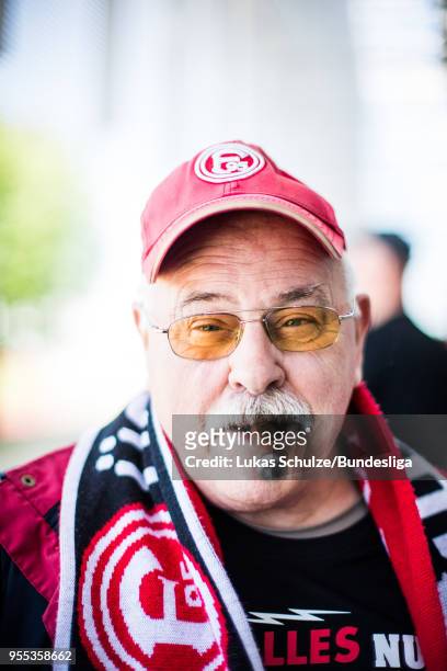 Fan of Duesseldorf poses with his cigar prior to the Second Bundesliga match between Fortuna Duesseldorf and Holstein Kiel at Esprit-Arena on May 6,...
