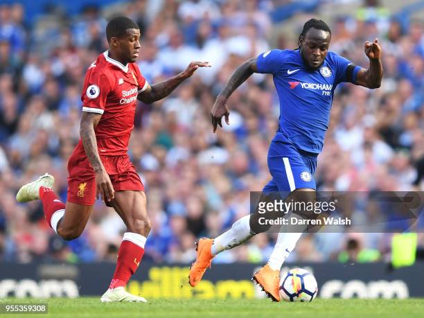 Victor Moses of Chelsea is challenged by Georginio Wijnaldum of Liverpool during the Premier League match between Chelsea and Liverpool at Stamford...
