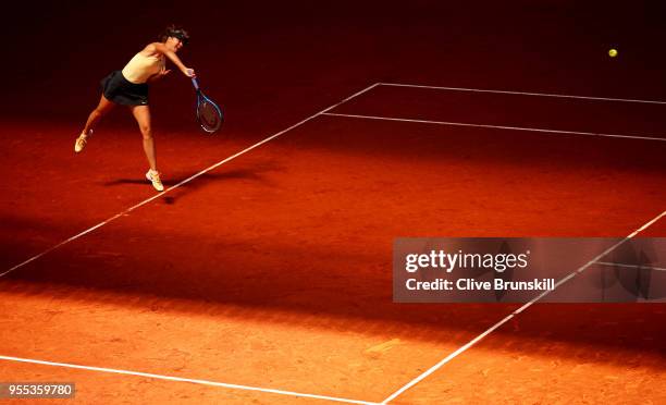 Maria Sharapova of Russia serves against Mihaela Buzarnescu of Romania in their first round match during day two of the Mutua Madrid Open tennis...