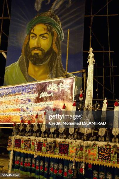 Iranian Muslims Shiites attend a ceremony to mark Ashura , the commemoration of the death of Imam Hussein , a grandson of Islam 's Prophet Mohammad ,...