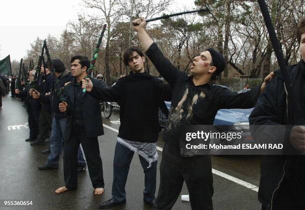 Iranian Muslims Shiites attend a ceremony to mark Ashura , the commemoration of the death of Imam Hussein , a grandson of Islam 's Prophet Mohammad ,...