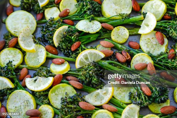 roasted veggies - broccolini stock pictures, royalty-free photos & images