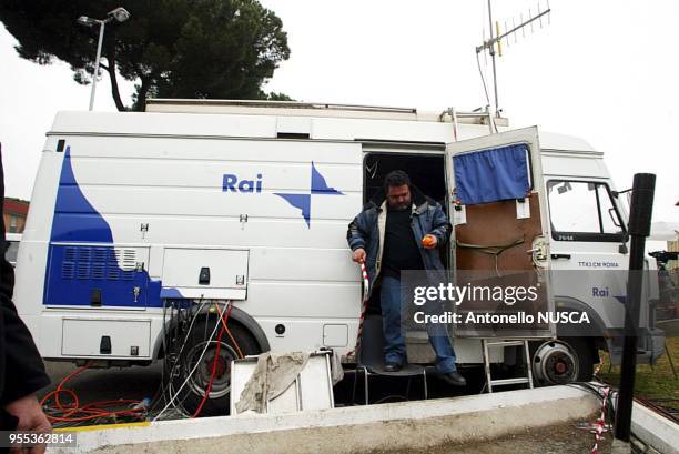 Media and television dishes take their position in front of Gemelli Policlinico after Pope John Paul was rushed to a Rome hospital.