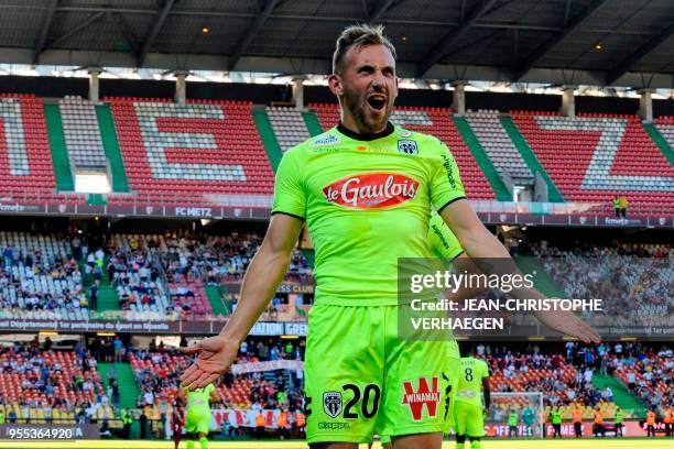 Angers' French midfielder Flavien Tait celebrates after scoring a goal during the French L1 football match between Metz and Angers on May 6, 2018 at...