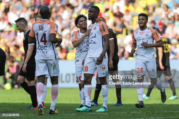 Isaac Mbenza of Montpellier celebrates with Keagan Dolly of Montpellier after scoring the second goal goal during the Ligue 1 match between Nantes...
