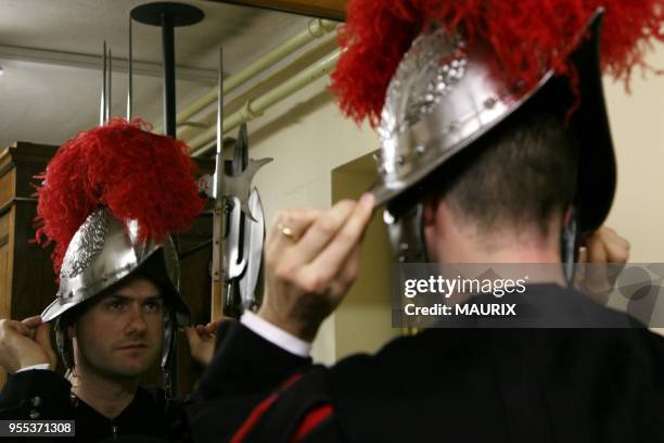 Recruits of the Vatican's elite Swiss Guard check their uniform before the swearing in ceremony for new members at the Cortile di San Damaso at the...