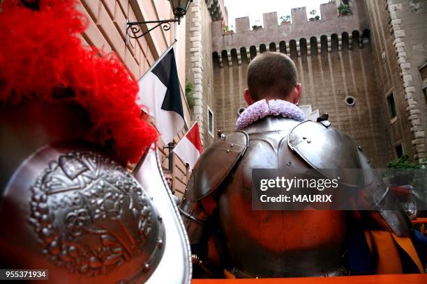 Recruits of the Vatican's elite Swiss Guard check their uniform before the swearing in ceremony for new members at the Cortile di San Damaso at the...