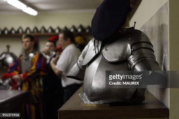 Recruits of the Vatican's elite Swiss Guard check their uniform before the swearing in ceremony for new members at the Cortile di San Damaso at the...