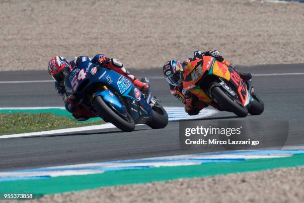 Mattia Pasini of Italy and Italtrans Racing leads Brad Binder of South Africa and Red Bull KTM Ajo during the Moto2 race during the MotoGp of Spain -...