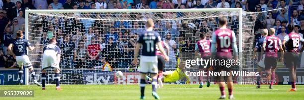 Mark Bunn of Aston Villa saves a penalty during the Sky Bet Championship match between Millwall and Aston Villa at the Den on May 06, 2018 in London,...