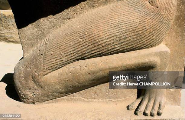 Temple of Amon Re at Karnak. East Thebes. This larger than life-size statue is sculpted from a block of sandstone and rests in the hypostyle room....