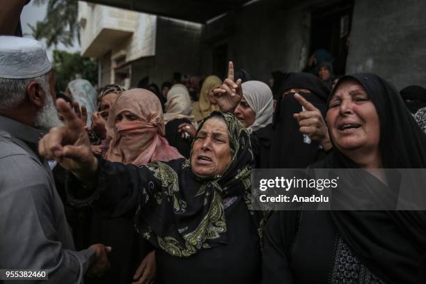 Relatives of Beha Abdurrahman Kadih who was killed after Israeli soldiers opened fire, mourn during his funeral ceremony at Abasan al-Kabira town in...