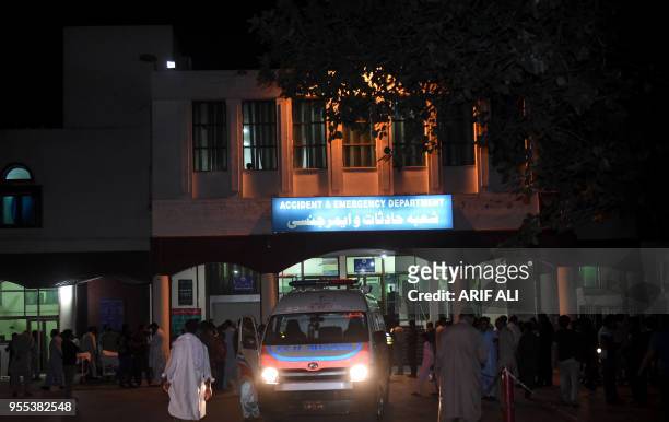 An ambulance is parked outside the hospital emergency after shifting injured Pakistan interior minister Ahsan Iqbal in Lahore on May 6, 2018. -...