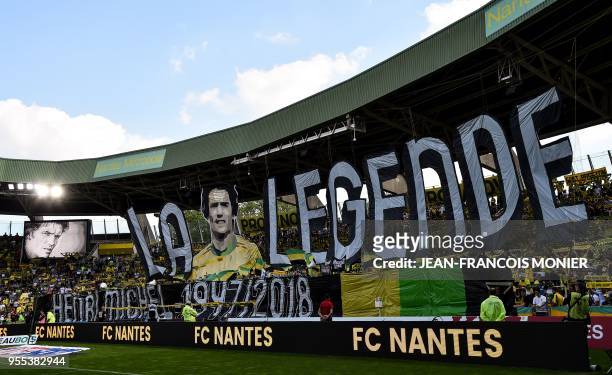 Nantes' supporters pay their respects to late player Henri Michel prior to the French L1 football match between Nantes and Montpellier , on May 6 at...