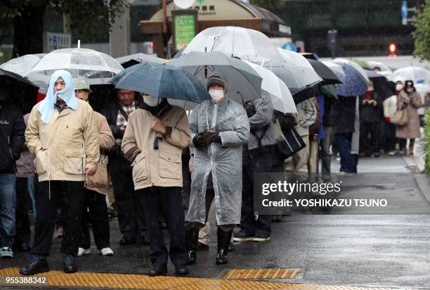 Thousands of punters queued up for tickets of the one billion yen "Year-end Jumbo Lottery" as the first tickets go on sale in Tokyo on November 24,...