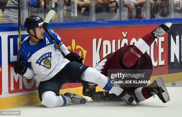 Finland's Mikko Rantanen and Latvia's Kristians Rubins fall down during the group B match Latvia vs Finland of the 2018 IIHF Ice Hockey World...