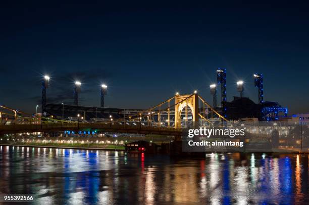 night view of  bridge over allegheny river with pnc park in background in pittsburgh - allegheny river stock pictures, royalty-free photos & images