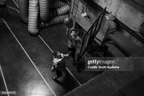 Mikhail Sergachev and Chris Kunitz of the Tampa Bay Lightning play basketball during the pregame warm ups against the Boston Bruins during Game Five...