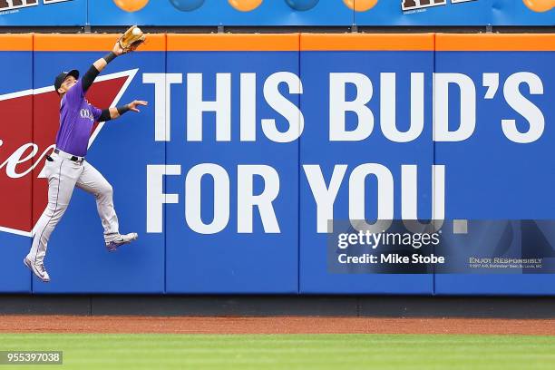 Gerardo Parra of the Colorado Rockies makes a leaping catch off the bat of Asdrubal Cabrera of the New York Mets in the sixth inning at Citi Field on...