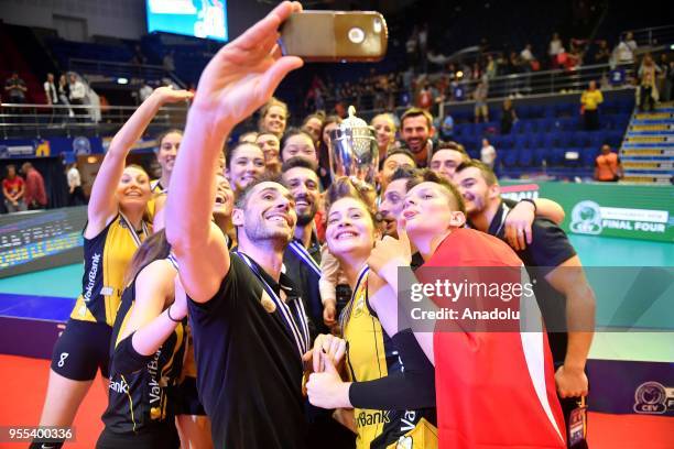 VakifBank Istanbul's players pose for a photo as they celebrate after winning the Gold medal following the match between CS Volei Alba Blaj and...