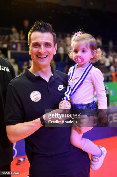 VakifBank Istanbul's head coach Giovanni Guidetti poses for a photo as he celebrates after winning the Gold medal following the match between CS...