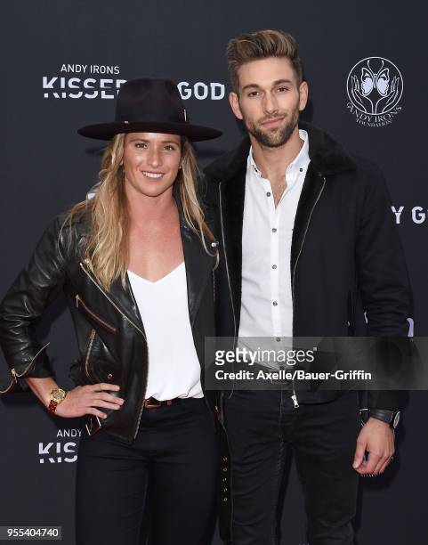 Surfer Surfer Courtney Conlogue and guest arrive at Teton Gravity Research's 'Andy Irons: Kissed by God' World Premiere at Regency Village Theatre on...