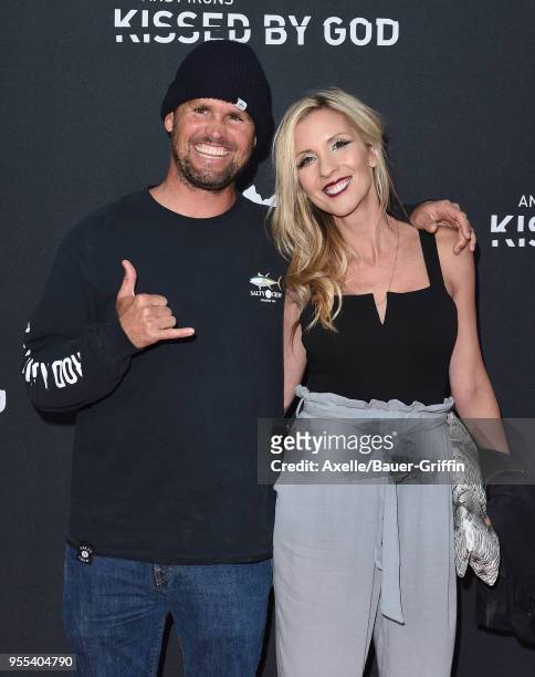 Surfer Damien Hobgood and wife Charlotte Hobgood arrive at Teton Gravity Research's 'Andy Irons: Kissed by God' World Premiere at Regency Village...