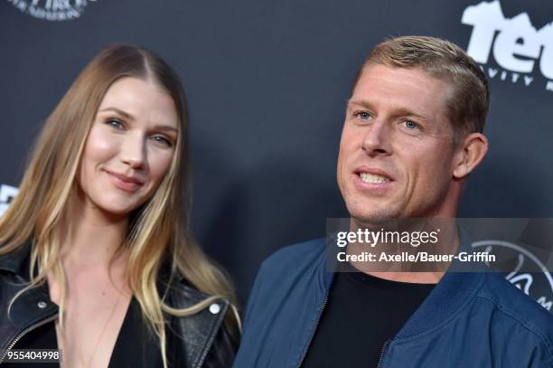 Surfer Mick Fanning and Breeana Randall arrive at Teton Gravity Research's 'Andy Irons: Kissed by God' World Premiere at Regency Village Theatre on...