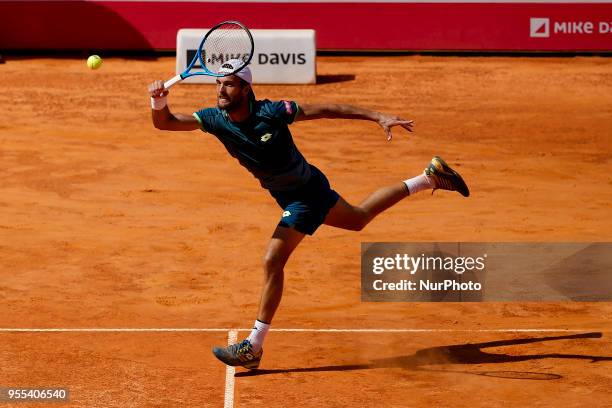 Portuguese tennis player Joao Sousa returns a ball to North-American tennis player Frances Tiafoe during their Millennium Estoril Open ATP Singles...