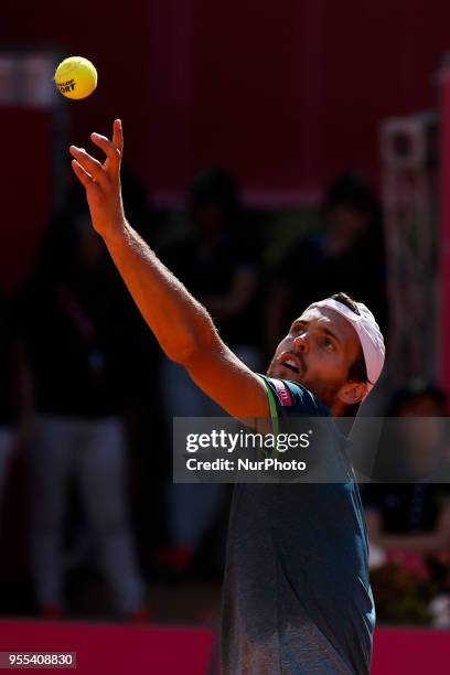 Portuguese tennis player Joao Sousa serves to North-American tennis player Frances Tiafoe during their Millennium Estoril Open ATP Singles final...