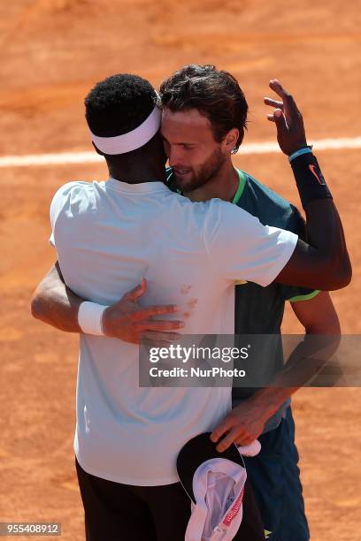 Joao Sousa of Portugal hugs Frances Tiafoe of US after winning the Millennium Estoril Open ATP 250 tennis tournament final, at the Clube de Tenis do...