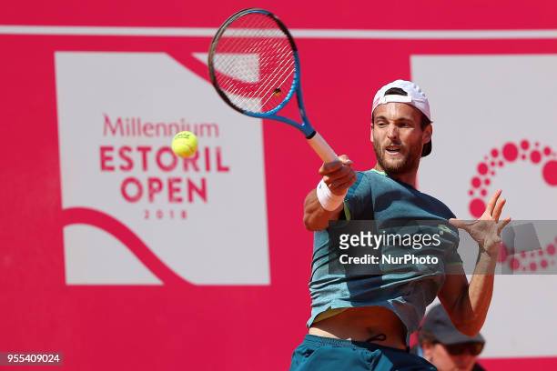 Joao Sousa of Portugal returns a ball to Frances Tiafoe of US during the Millennium Estoril Open ATP 250 tennis tournament final, at the Clube de...