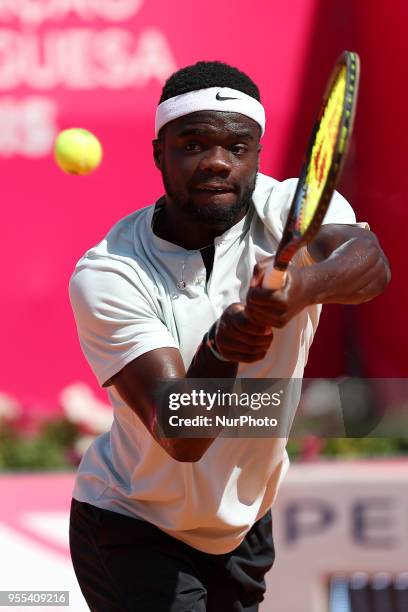 Frances Tiafoe of US returns a ball to Joao Sousa of Portugal during the Millennium Estoril Open ATP 250 tennis tournament final, at the Clube de...