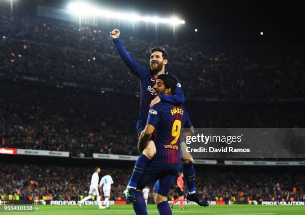 Lionel Messi of Barcelona celebrates after scoring his sides second goal with Luis Suarez of Barcelona during the La Liga match between Barcelona and...