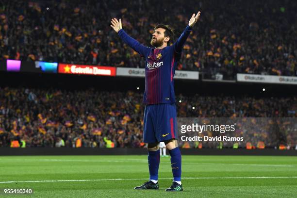 Lionel Messi of Barcelona celebrates after scoring his sides second goal during the La Liga match between Barcelona and Real Madrid at Camp Nou on...