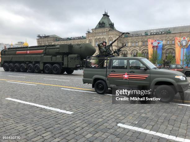 Russian Yars ballistic nuclear missiles on mobile launchers roll through Red Square during the Victory Day military parade rehearsals on May 6, 2018...