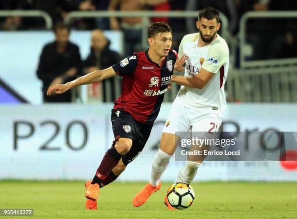 Cagliari, ITALY contrast with Nicolò Barella of Cagliari and Maxime Gonalons of roma during the serie A match between Cagliari Calcio and AS Roma at...