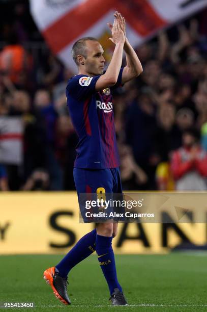 Andres Iniesta of Barcelona applauds the crowd as he is substituted in his final El Clasico during the La Liga match between Barcelona and Real...