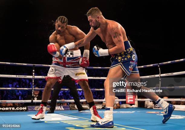 David Haye and Tony Bellew in action during the Heavyweight contest between Tony Bellew and David Haye at The O2 Arena on May 5, 2018 in London,...