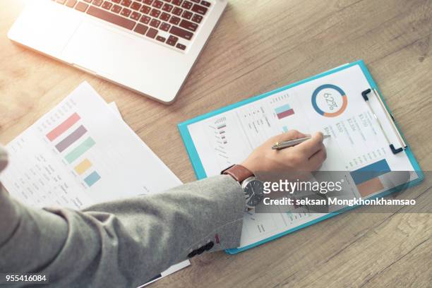 businessman analyzing investment charts. accounting - portfolio ストックフォトと画像