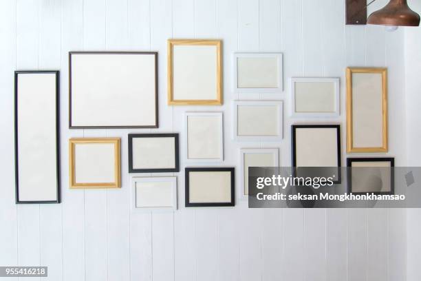 classic frame on white cement wall in showroom and gallery. - art gallery wall stock pictures, royalty-free photos & images