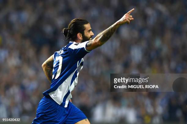 Porto's Portuguese midfielder Sergio Oliveira celebrates after scoring a goal during the Portuguese league football match between FC Porto and CD...